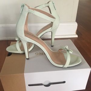 Light teal “Call It Spring” high heels.